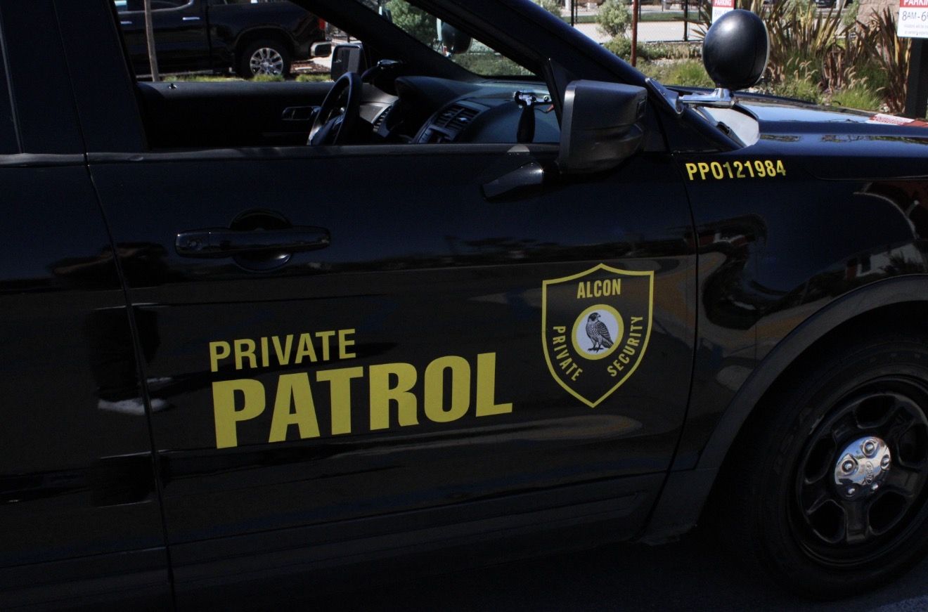 Alcon Private Patrol shield on the door of a patrol vehicle
